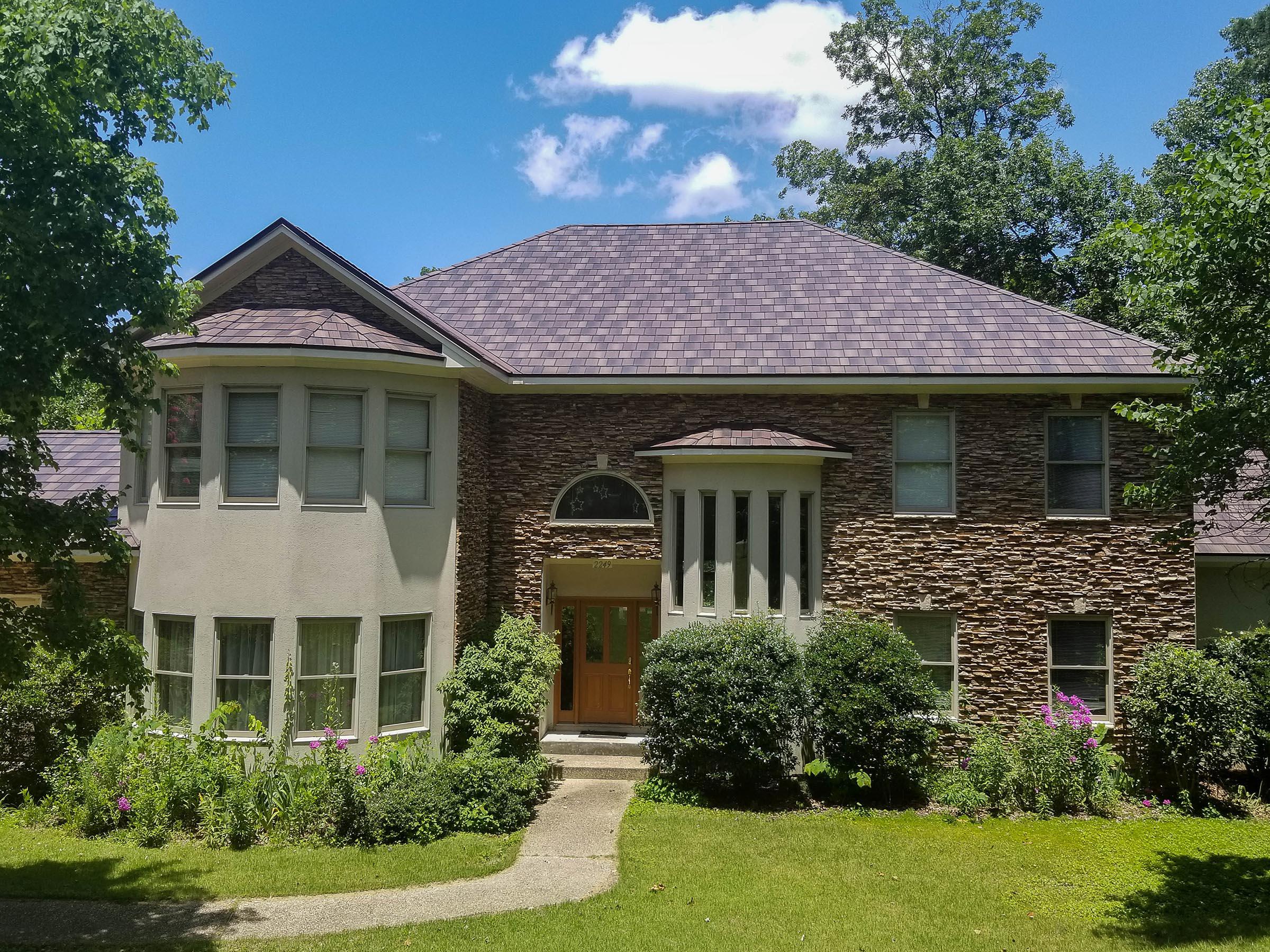 EDCO's Arrowline Shake Roofing in Royal Brown Enhanced was selected by the homeowners because of its lifetime warranty and fade protection.