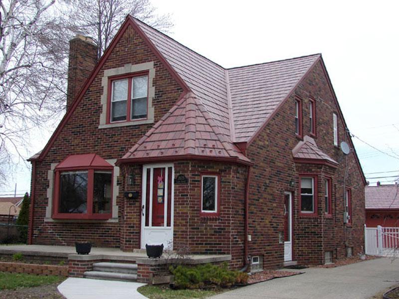 The charm of this historical home was kept intact with the selection and installation of EDCO Slate Siding in Classic Red Blend to complement the brick structure