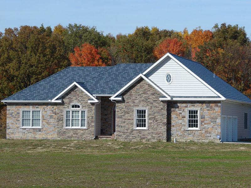 This beautiful rambler in rural Michigan with unqiue charm features the Arrowline Slate Stone Blend Roofing which achieves the look of natural slate for a fraction of the weight and cost