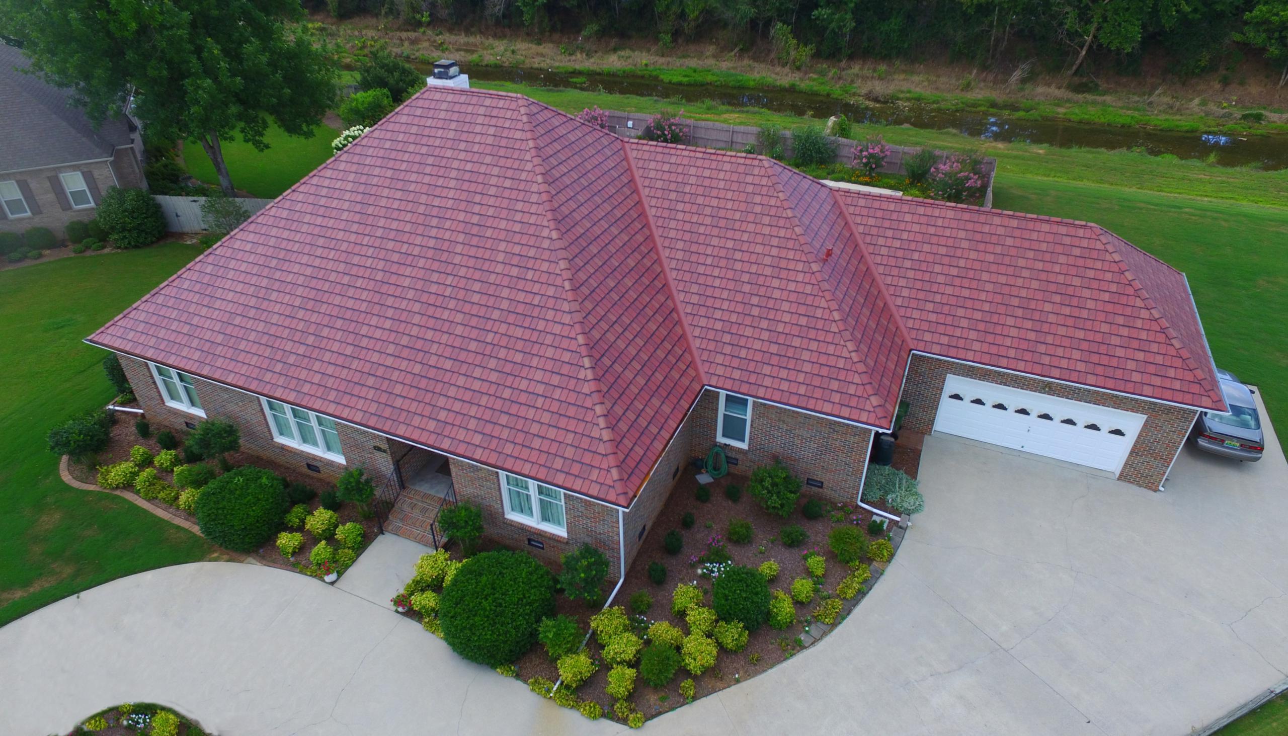 This beautiful rambler in Alabama installed EDCOs Arrowline Enhanced Slate Classic Red Blend Roofing to compliment the brick color on the home.