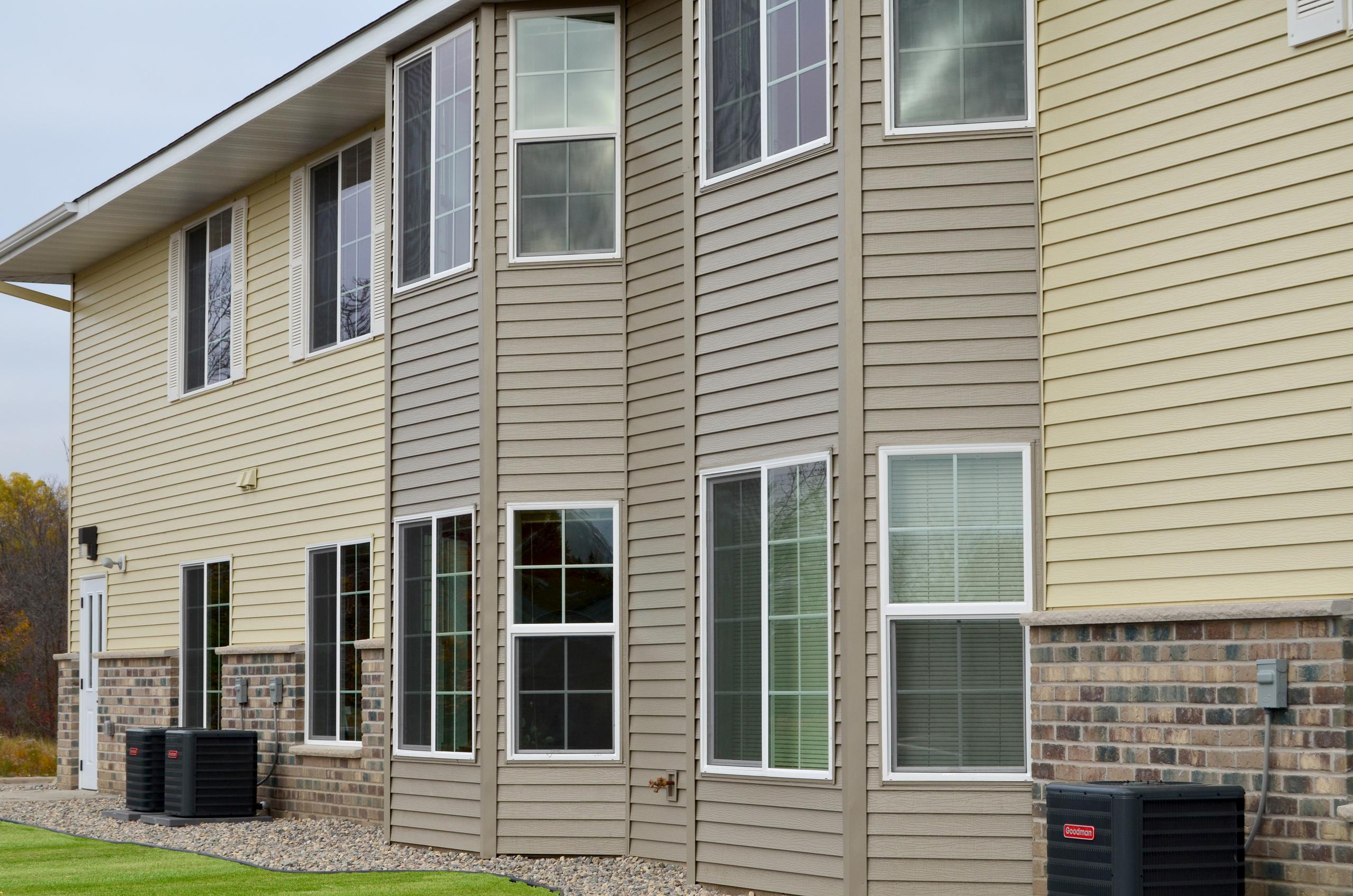 Two complimentary siding colors were installed at an apartment building in Minnesota to give it a distinctive look.