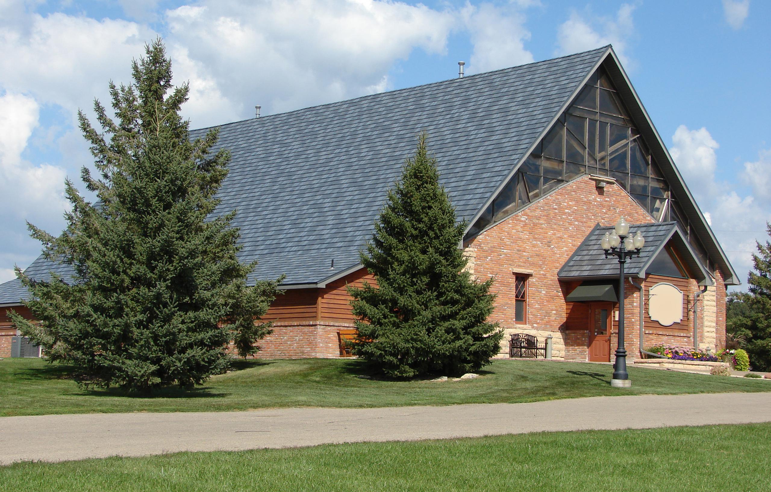 Architectural appeal was added to this charming church building when the EDCO Arrowline Slate Stone Blend Roofing was installed.