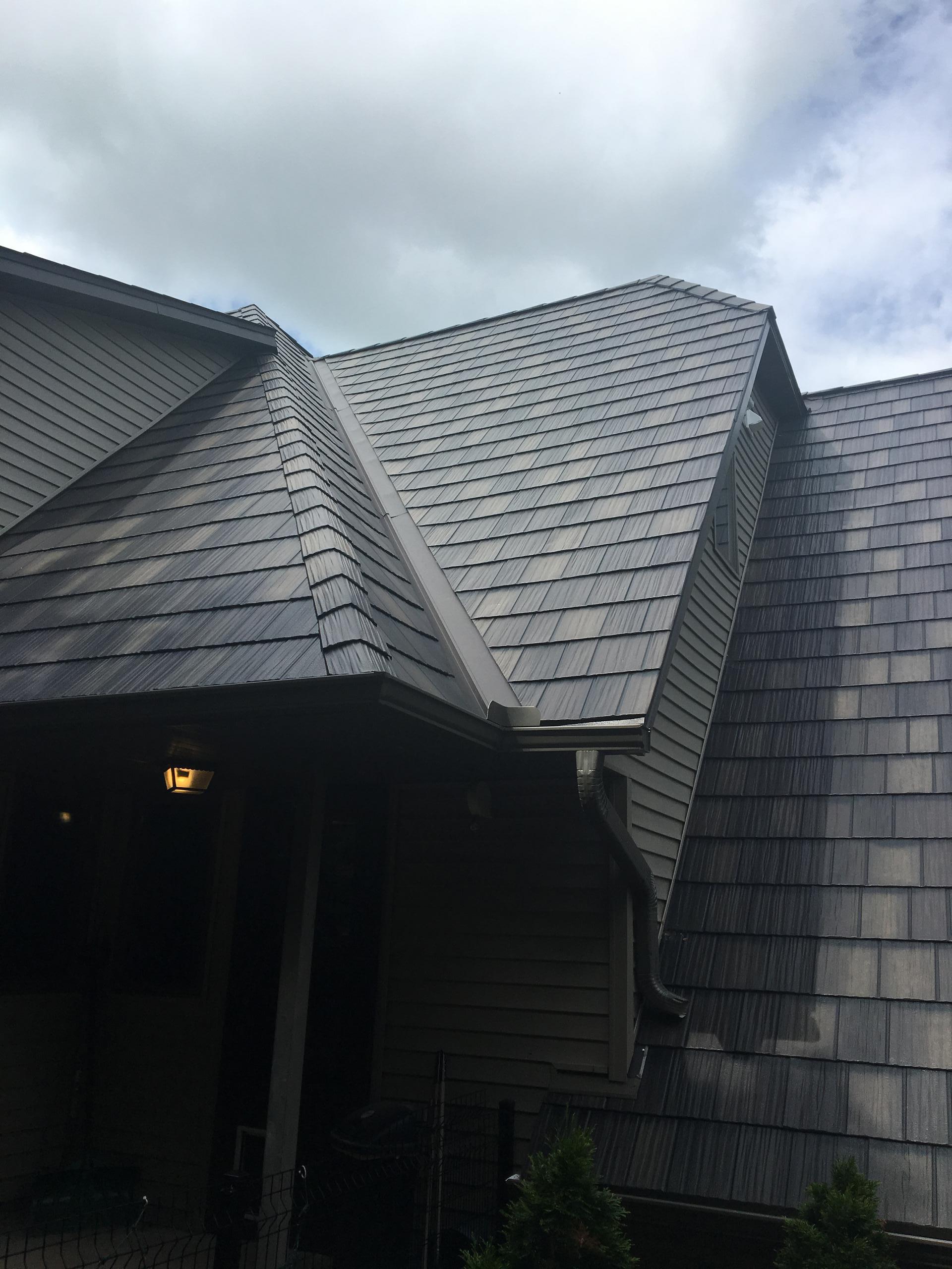 ArrowLine Statuary Bronze Enhanced Shake roofing gives this home quality and style that is everlasting.