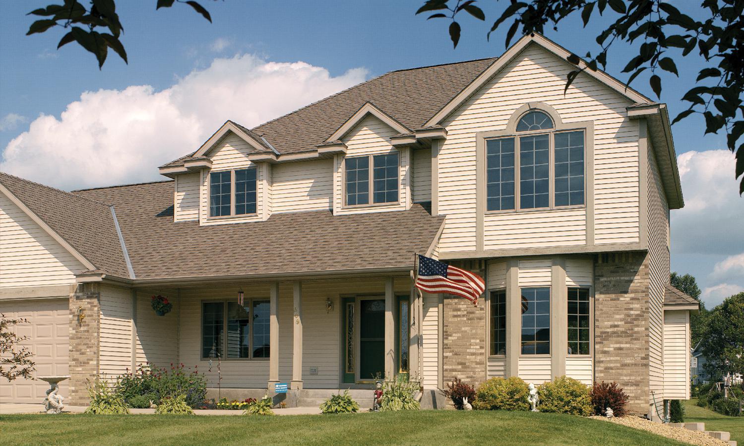 D4 Traditional Lap siding in Wickertone provides for a timeless look that completes the exterior of this home