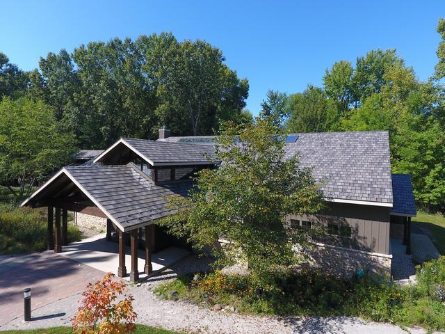 ArrowLine Enhanced Slate Roofing and Vertical 12" Board and Batten Siding