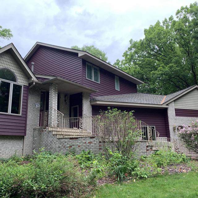 The beauty of this single-family home was unlocked with the installation of EDCO's Single 6" Prism lap siding in Bordeaux color. 