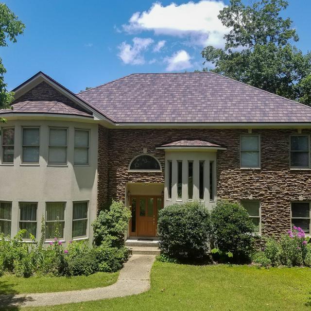 EDCO's Arrowline Shake Roofing in Royal Brown Enhanced was selected by the homeowners because of its lifetime warranty and fade protection.