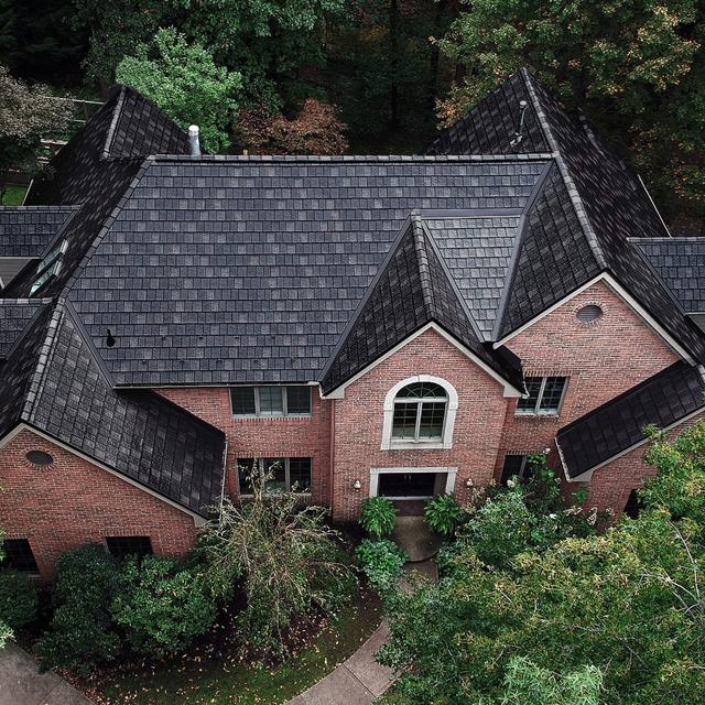 This beautiful home became stuffing after the installation of EDCO's ArrowLine Slate Statuary Bronze roofing. Gives it the "WOW" factor!