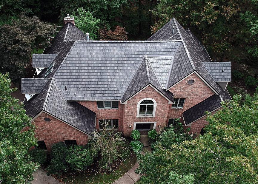 This beautiful home became stuffing after the installation of EDCO's ArrowLine Slate Statuary Bronze roofing. Gives it the "WOW" factor!