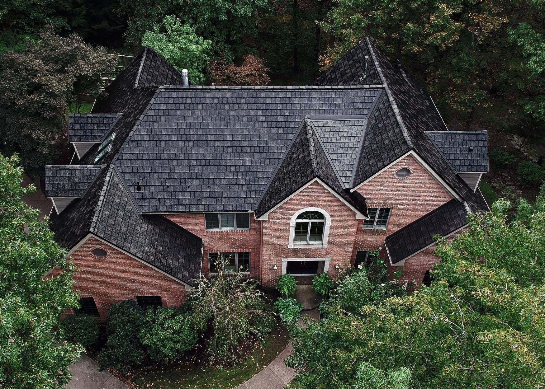 This beautiful home became stuffing after the installation of EDCO's ArrowLine Slate Statuary Bronze roofing. Gives it the "WOW" factor!