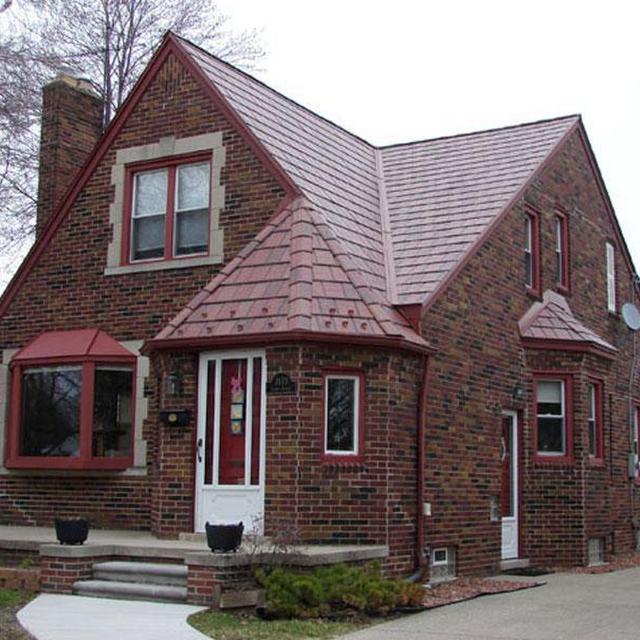 The charm of this historical home was kept intact with the selection and installation of EDCO Slate Siding in Classic Red Blend to complement the brick structure