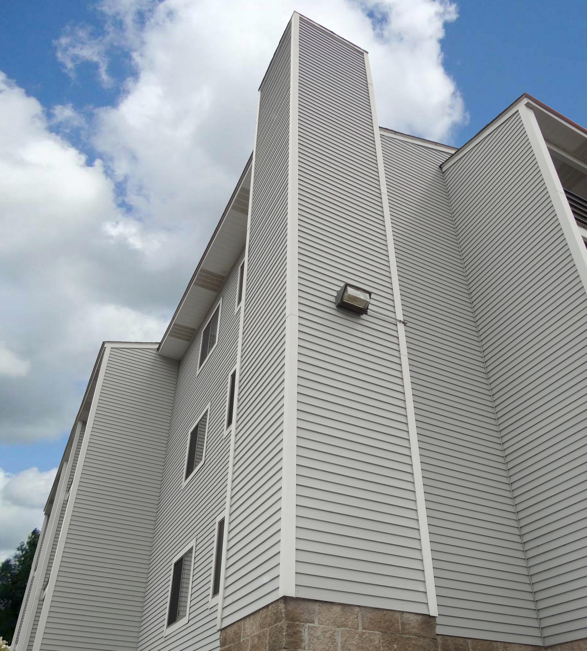 A large apartment complex chose EDCO's D4 Traditional Lap Siding in Driftwood gray and a complementary trim in Colonial White which provides a consistent appearance that will last a lifetime.