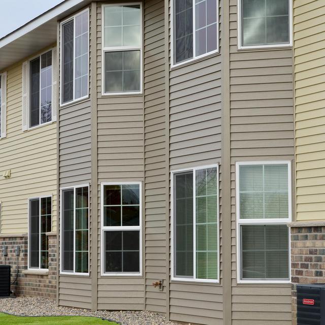 Two complimentary siding colors were installed at an apartment building in Minnesota to give it a distinctive look.