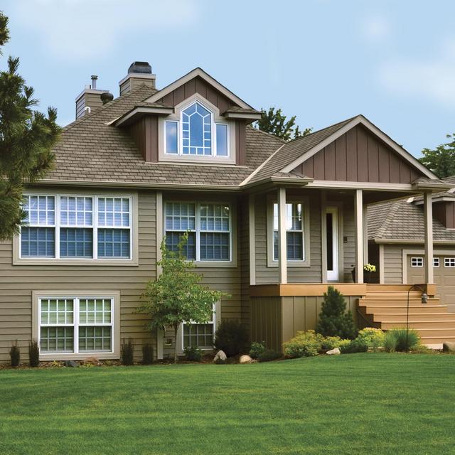 Vertical 12" Board and Batten in Mahogany gives this home beauty as it color-coordinates with EDCO's Single 6" Traditional Lap Siding and Soffit, Fascia and Trim which is also from EDCO