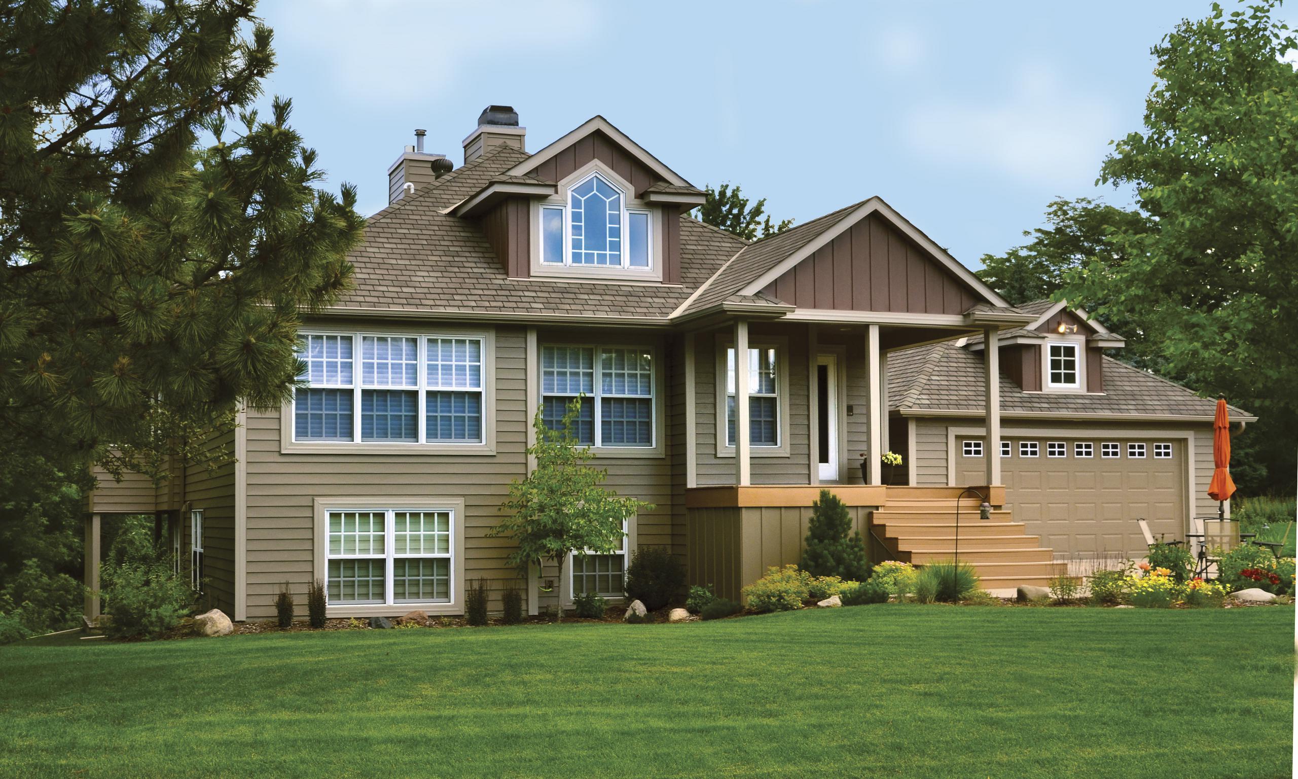 Vertical 12" Board and Batten in Mahogany gives this home beauty as it color-coordinates with EDCO's Single 6" Traditional Lap Siding and Soffit, Fascia and Trim which is also from EDCO