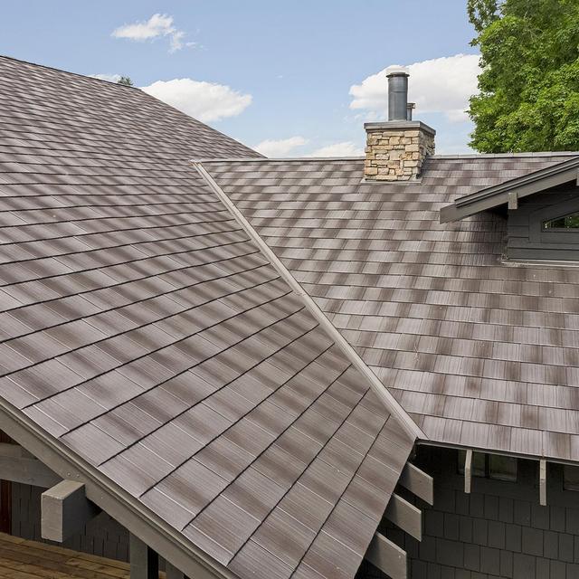 A unique rustic appearance of Infiniti Roadhouse roofing gives this home additional personality.