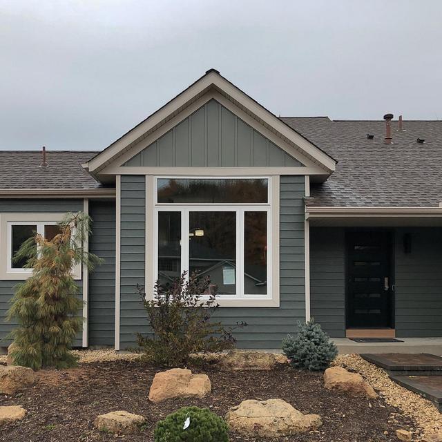 The homeowners of this rambler home in the Twin Cities chose EDCO's Traditional Lap Siding in Willow and Board and Batten in Sage to give their new home timeless style.