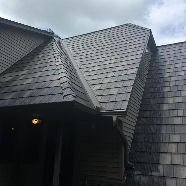ArrowLine Statuary Bronze Enhanced Shake roofing gives this home quality and style that is everlasting.