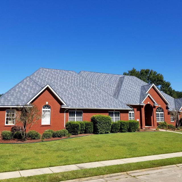 The award-winning Infiniti roofing from EDCO in Granite Gray Enhanced was selected for this red brick home to give it a distinctive appearance the is unmatched,