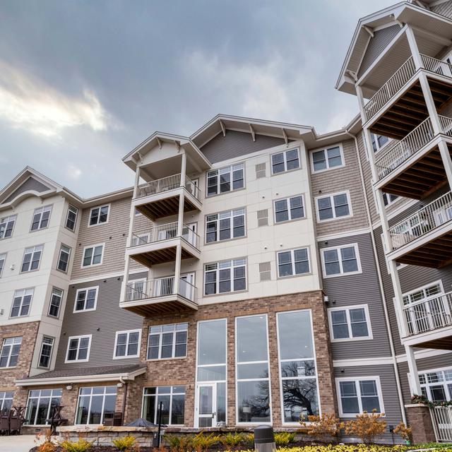 EDCO's D4 Traditional Lap Siding in Timber and Antique Parchment Trim.